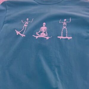 teal and white skelton graphic tee